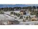 Community overview featuring houses with mountain views in winter at 4812 Moonshine Ridge Trl, Parker, CO 80134