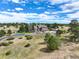 Luxury home with a circular driveway and expansive landscaping at 4812 Moonshine Ridge Trl, Parker, CO 80134