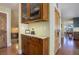 Butlers pantry with granite countertop and wood cabinetry at 4812 Moonshine Ridge Trl, Parker, CO 80134