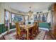 Elegant dining room with a chandelier, hardwood floors, and built-in hutch at 4812 Moonshine Ridge Trl, Parker, CO 80134