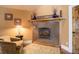 Cozy living room with a fireplace and tiled surround at 4812 Moonshine Ridge Trl, Parker, CO 80134