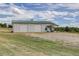 Large detached garage with three garage doors at 4812 Moonshine Ridge Trl, Parker, CO 80134