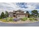 House exterior with circular driveway and landscaping at 4812 Moonshine Ridge Trl, Parker, CO 80134