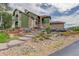 House exterior with landscaping and walkway at 4812 Moonshine Ridge Trl, Parker, CO 80134