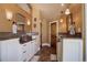 Main bathroom with double vanity, large mirror, and tiled flooring at 4812 Moonshine Ridge Trl, Parker, CO 80134