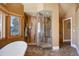 Main bathroom with walk-in shower and tiled walls at 4812 Moonshine Ridge Trl, Parker, CO 80134