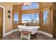 Main bathroom with soaking tub and stunning views at 4812 Moonshine Ridge Trl, Parker, CO 80134