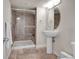 Bathroom with step-in shower and pedestal sink at 15972 W 70Th Dr, Arvada, CO 80007