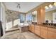 Bright bathroom featuring a soaking tub, glass shower and double sink vanity at 15972 W 70Th Dr, Arvada, CO 80007