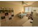 Cozy bedroom with a bed, shelving, and window coverings at 15972 W 70Th Dr, Arvada, CO 80007