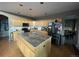 Spacious kitchen with granite island and stainless steel appliances at 15972 W 70Th Dr, Arvada, CO 80007