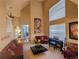 Open living room with high ceilings and natural light at 15972 W 70Th Dr, Arvada, CO 80007