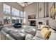 Bright and airy living room with a fireplace and lots of natural light at 15972 W 70Th Dr, Arvada, CO 80007