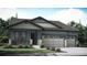 Charming single-story home showcasing a two-car garage and welcoming front porch at 15586 W Beloit Ave, Morrison, CO 80465