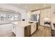 Modern kitchen features a large island with stainless steel appliances and plenty of cabinet space at 15586 W Beloit Ave, Morrison, CO 80465