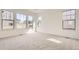 Spacious main bedroom features large windows and neutral carpeting at 15586 W Beloit Ave, Morrison, CO 80465
