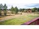 Expansive backyard featuring lush greenery, mature trees, and a charming wooden fence, perfect for outdoor enjoyment at 19052 E Briarwood Dr, Centennial, CO 80016