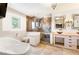 Elegant bathroom features a soaking tub, glass shower, double vanities, and stylish fixtures at 19052 E Briarwood Dr, Centennial, CO 80016
