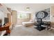 Cozy bedroom features neutral tones, a quaint window, and a dedicated workspace for comfort and productivity at 19052 E Briarwood Dr, Centennial, CO 80016