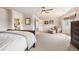 Large bedroom showcases comfortable seating, neutral tones, and an ensuite bathroom at 19052 E Briarwood Dr, Centennial, CO 80016