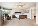 Spacious bedroom features a king bed, natural light, and neutral tones at 19052 E Briarwood Dr, Centennial, CO 80016