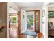 Inviting foyer with beautiful hardwood floors, an open doorway, and a view to the outside at 19052 E Briarwood Dr, Centennial, CO 80016