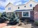 Charming two-story home with brick and siding, beautiful front garden and mature trees at 19052 E Briarwood Dr, Centennial, CO 80016