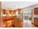 Well-appointed kitchen with wooden cabinets, modern appliances, and hardwood floors at 19052 E Briarwood Dr, Centennial, CO 80016