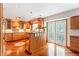 Spacious kitchen with custom cabinets, granite countertops, a unique island, and stainless steel appliances at 19052 E Briarwood Dr, Centennial, CO 80016