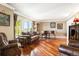 Bright and airy living room with hardwood floors, comfortable seating, and a view of the outdoors at 19052 E Briarwood Dr, Centennial, CO 80016