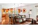 Comfortable living room showcases hardwood floors, a breakfast bar, and an open concept layout at 19052 E Briarwood Dr, Centennial, CO 80016