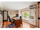 Home office offers built-in bookshelves, natural light, and a comfortable workspace at 19052 E Briarwood Dr, Centennial, CO 80016