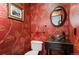Charming powder room with elegant wall paper and unique bowl sink at 19052 E Briarwood Dr, Centennial, CO 80016