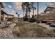 Spacious backyard with green grass, mature trees, and beautiful landscape elements at 1775 Catnap Ln, Monument, CO 80132