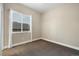 Clean, neutral bedroom featuring a large window and plush carpeting, providing a comfortable living space at 1775 Catnap Ln, Monument, CO 80132