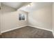 Bright bedroom featuring neutral walls, plush carpet, and a window offering natural light at 1775 Catnap Ln, Monument, CO 80132