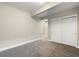 Neutral bedroom with carpet, closet, and open entry to hall at 1775 Catnap Ln, Monument, CO 80132