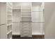 Spacious walk-in closet with custom shelving and drawer systems for optimal organization at 1775 Catnap Ln, Monument, CO 80132