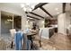 Dining room featuring hardwood floors, wood-beamed ceilings, and a stylish table setting at 1775 Catnap Ln, Monument, CO 80132