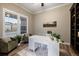 Comfortable office with large windows, stylish decor, hardwood floors and a built-in bookcase at 1775 Catnap Ln, Monument, CO 80132
