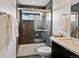 Modern bathroom with glass shower, granite countertop, and stylish tile at 1585 Hecla Way # 201, Louisville, CO 80027