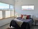 Well-lit bedroom with large windows and comfortable bedding at 1585 Hecla Way # 201, Louisville, CO 80027