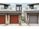 Modern townhome showcasing individual garages and contemporary siding at 1585 Hecla Way # 201, Louisville, CO 80027
