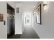 Hallway with elevator access features carpeted floors and bright lighting fixtures at 1585 Hecla Way # 201, Louisville, CO 80027