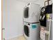 Convenient laundry room with stacked washer and dryer plus water heater at 1585 Hecla Way # 201, Louisville, CO 80027