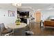Open concept living room with modern kitchen, dining area, and hardwood flooring at 1585 Hecla Way # 201, Louisville, CO 80027