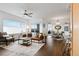 Bright living room featuring a stylish leather sofa, dining area, and large window with scenic views at 1585 Hecla Way # 201, Louisville, CO 80027