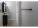 Bathroom featuring a sink and black cabinets, and a tile floor at 12425 Albion St, Thornton, CO 80241