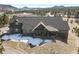 Aerial view of the home showcasing the expansive property with mountain views at 5800 Elk View Ct, Larkspur, CO 80118