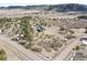 An aerial photograph revealing the home's secluded setting amidst the trees at 5800 Elk View Ct, Larkspur, CO 80118